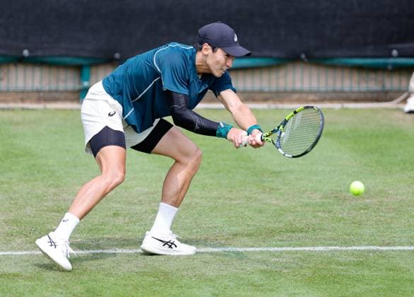 3rd June 2025; Edgbaston Priory Club, Birmingham, England: Lexus Birmingham Open Tennis, Day 2; Yosuke Watanuki (JPN) low backhand in his mens singles match against Alexander Blockx (BEL)  ActionPlus12797802 RogerxEvans