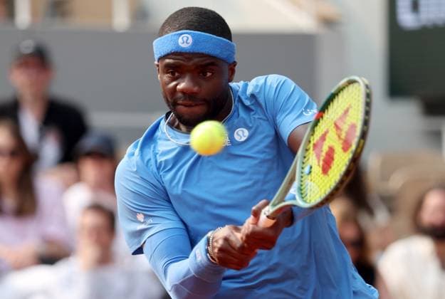 Frances Tiafoe of the United States plays against Lorenzo Musetti of Italy during their quarterfinal match of the French Tennis Open in Roland Garros in Paris, France, on Tuesday, June 3, 2025. Musetti won 6-2, 4-6, 7-5, 6-2.  PAR20250603208 MAYAxVIDON-WHITE
