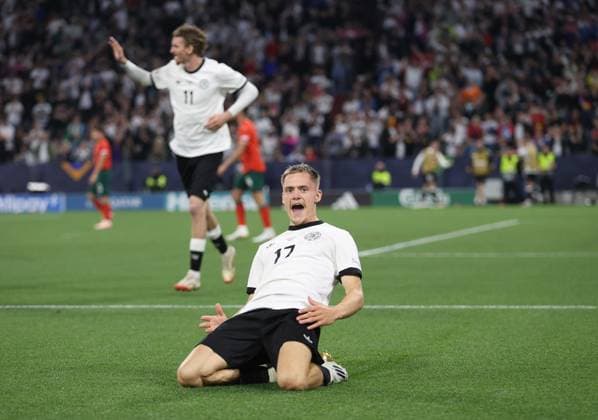 Sport Bilder des Tages - Germany v Portugal, UEFA Nations League 2025, semi-final, Munich Football Arena, Allianz Arena, Munich, Germany - 4th June 2024. (C) Daniel Weir Crystal Pix GOAL 1-0, Florian Wirtz of Germany national team, Nationalteam goal celebration with a knee slide after scoring a goal to put them 1-0 ahead against Portugal. - Germany v Portugal, UEFA Nations League 2025, semi-final, Munich Football Arena, Allianz Arena, Munich, Germany - 4th June 2024. (C) Daniel Weir Crystal Pix Munich Allianz Arena Germany Copyright: xDanxWeirx CP_Germany_Portugal_06
