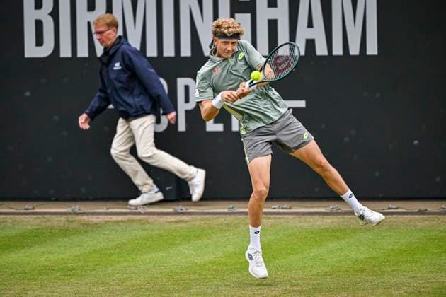 5th June 2025; Edgbaston Priory Club, Birmingham, England: Lexus Birmingham Open Tennis, Day 4; Martin Landaluce (ESP) is cramped for space as he hits a backhand in the match against Lloyd Harris (RSA) and the linesman runs for cover  ActionPlus12798440 GodfreyxPitt