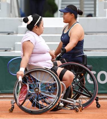 (250606) -- PARIS, June 6, 2025 -- Li Xiaohui (R) Wang Ziying react during the wheelchair tennis women s doubles semifinal match between Pauline Deroulede of France Aniek Van Koot of the Netherlands and Li Xiaohui Wang Ziying of China at the French Open tennis tournament at Roland Garros, Paris, France, June 5, 2025. ) (SP)FRANCE-PARIS-WHEELCHAIR TENNIS-FRENCH OPEN-WOMEN S DOUBLES-SEMIFINAL LixJing 