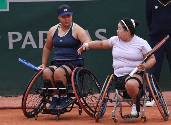 (250606) -- PARIS, June 6, 2025 -- Li Xiaohui (L) Wang Ziying react during the wheelchair tennis women s doubles semifinal match between Pauline Deroulede of France Aniek Van Koot of the Netherlands and Li Xiaohui Wang Ziying of China at the French Open tennis tournament at Roland Garros, Paris, France, June 5, 2025. ) (SP)FRANCE-PARIS-WHEELCHAIR TENNIS-FRENCH OPEN-WOMEN S DOUBLES-SEMIFINAL LixJing 