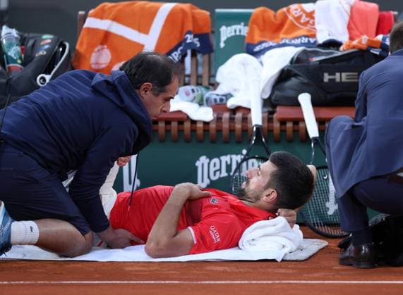 Novak Djokovic receives a medical time out on his leg French Open Tennis, Day Thirteen, Tennis, Roland Garros, Paris, France - 06 Jun 2025 EDITORIAL USE ONLY No use with unauthorised audio, video, data, fixture lists, club league logos or live services. Online in-match use limited to 120 images, no video emulation. No use in betting, games or single club league player publications. Copyright: xEllaxLing Shutterstockx 15338002bb