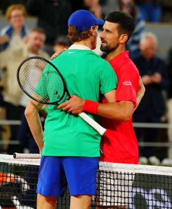 Novak Djokovic speaks to Jannik Sinner at the net at the end of their semi final, won by the Italian French Open Tennis, Day Thirteen, Tennis, Roland Garros, Paris, France - 06 Jun 2025 EDITORIAL USE ONLY No use with unauthorised audio, video, data, fixture lists, club league logos or live services. Online in-match use limited to 120 images, no video emulation. No use in betting, games or single club league player publications. Copyright: xJavierxGarcia Shutterstockx 15338000bx