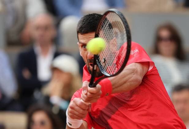Serb Novak Djokovic plays against top-seeded Jannik Sinner of Italy during their semi-final match at the French Tennis Open in Roland Garros in Paris, France, on Friday, June 6, 2025. Sinner won 6-4, 7-5, 7-6 and advanced to the final.  PAR20250607239 MAYAxVIDON-WHITE