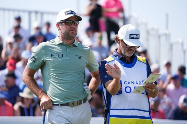 RBC Canadian Open 2025 - Round Three CALEDON, CANADA - JUNE 7 : Corey Conners of Canada talks with his caddie Danny Sahl before playing his shot from the 1st tee during the third round of the RBC Canadian Open 2025 at TPC Toronto at Osprey Valley in Caledon, Ontario, Canada on June 7, 2025. Mert Alper Dervis Anadolu Ontario Canada. Editorial use only. Please get in touch for any other usage.  Copyright: x2025xAnadoluxMertxAlperxDervisx