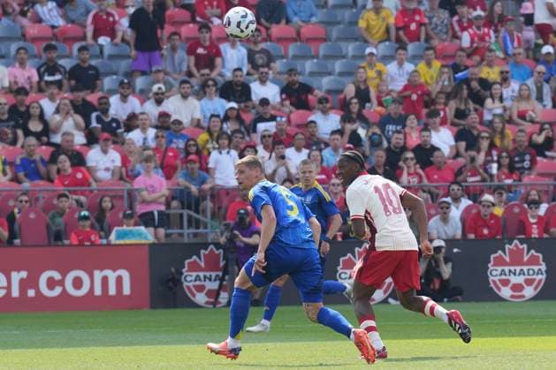 June 7, 2025, Toronto, On, CAN: Canada s Jonathan David (10) loops a header to score his his country s second goal as Ukraine s Valerii Bondar looks on during first half action in the Canadian Shield Tournament, in Toronto, Saturday, June 7, 2025. Valerii Bondar ; Jonathan David  - ZUMAc35_ 20250607_zaf_c35_077 Copyright: xChrisxYoungx