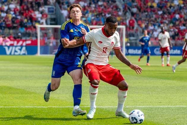 June 7, 2025, Toronto, Ontario, Canada: Derek Cornelius 13 (R) battles for the ball against Viktor Tsyhankov 15 (L) during the Canadian Shield Tournament match at BMO Field on June 7, 2025 in Toronto, Ontario, Canada. The game ended 4-2 for Canada Toronto Canada - ZUMAm154 20250607_zap_m154_021 Copyright: xAngelxMarchinix