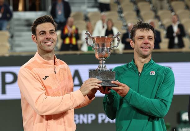 (250608) -- PARIS, June 8, 2025 -- Winners Marcel Granollers (R) Horacio Zeballos pose with the trophy during the awarding ceremony after the men s doubles final match between Marcel Granollers of Spain Horacio Zeballos of Argentina and Joe Salisbury Neal Skupski of Britain at the French Open tennis tournament at Roland Garros, Paris, France, June 7, 2025. ) (SP)FRANCE-PARIS-TENNIS-FRENCH OPEN-MEN S DOUBLES-FINAL LixJing 