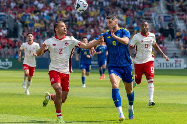 June 7, 2025, Toronto, Ontario, Canada: Zorhan Bassong 2 (L) battles for the ball against Roman Yaremchuk 9 (R) during the Canadian Shield Tournament match at BMO Field on June 7, 2025 in Toronto, Ontario, Canada. The game ended 4-2 for Canada Toronto Canada - ZUMAm154 20250607_zap_m154_041 Copyright: xAngelxMarchinix