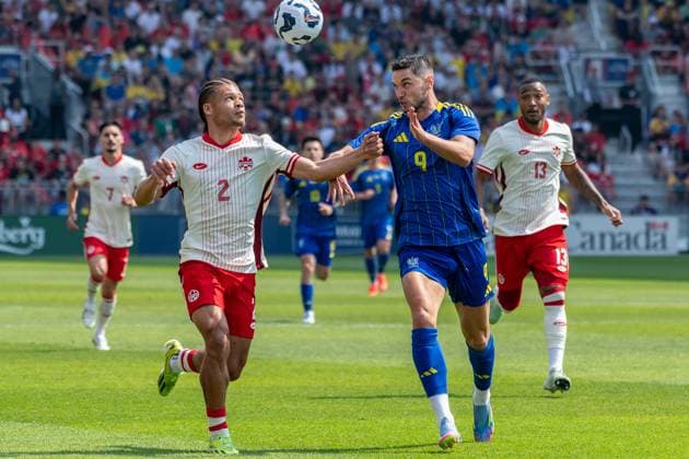 Canada Vs Ukraine in Toronto - 07 Jun 2025 Zorhan Bassong 2 (L)and Roman Yaremchuk 9 (R) seen in action during the Canadian Shield Tournament match between Ukraine and Canada at BMO Field. Final scores; Canada 4-2 Ukraine. Toronto Canada Copyright: xAngelxMarchinix xSOPAxImagesx CanadavUkraine-7-06-2025-4000