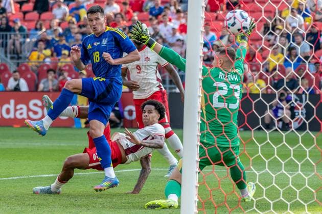 June 7, 2025, Toronto, Ontario, Canada: Tajon Buchanan 17 of Canada scores a goal against Dmytro Riznyk 23 (R) and Oleksandr Tymchyk 18 (L) during the Canadian Shield Tournament match between Ukraine and Canada at BMO Field. Final scores; Canada 4-2 Ukraine. Toronto Canada - ZUMAs197 20250607_aaa_s197_655 Copyright: xAngelxMarchinix
