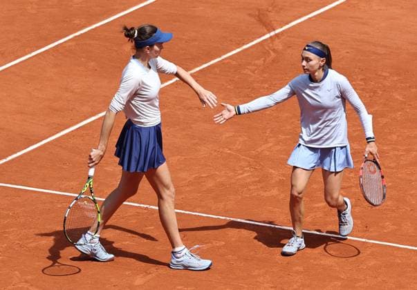(250608) -- PARIS, June 8, 2025 -- Anna Danilina (L) Aleksandra Krunic celebrate scoring during the women s doubles final between Anna Danilina of Kazakstan Aleksandra Krunic of Serbia and Sara Errani Jasmine Paolini of Italy at the French Open tennis tournament at Roland Garros, Paris, France, June 8, 2025. ) (SP)FRANCE-PARIS-TENNIS-FRENCH OPEN-WOMEN S DOUBLES-FINAL LixJing 