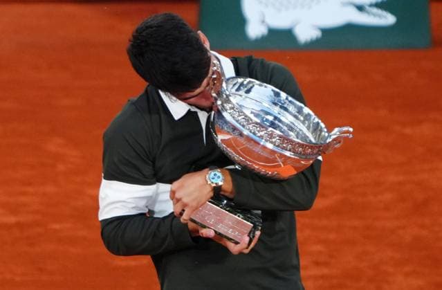Carlos Alcaraz with the trophy French Open Tennis, Day Fifteen, Tennis, Roland Garros, Paris, France - 08 Jun 2025 EDITORIAL USE ONLY No use with unauthorised audio, video, data, fixture lists, club league logos or live services. Online in-match use limited to 120 images, no video emulation. No use in betting, games or single club league player publications. Copyright: xJavierxGarcia Shutterstockx 15346224ay