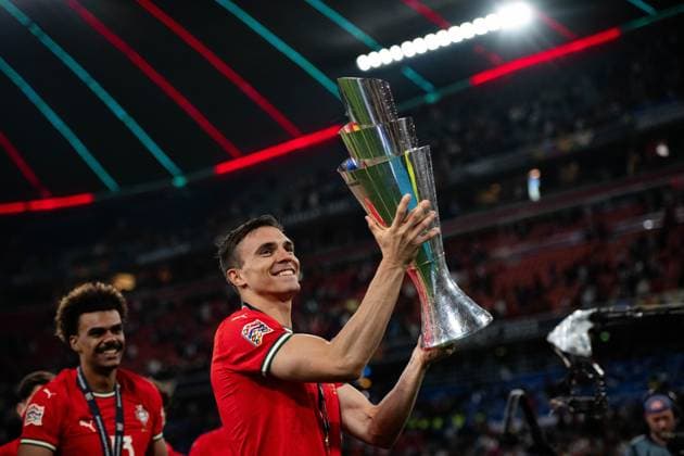 MUNICH, GERMANY - JUNE 08: Joao Palhinha of national team, Nationalteam of Portugal celebration with a trophy during the UEFA Nations League 2025 final match between Portugal National team and Spain National team at Munich Football Arena on June 08, 2025 in Munich, Germany. Photo Sebastian Frej Portugal national team v Spain national team - UEFA Nations League 2025 Final Copyright: xSebastianxFrejx