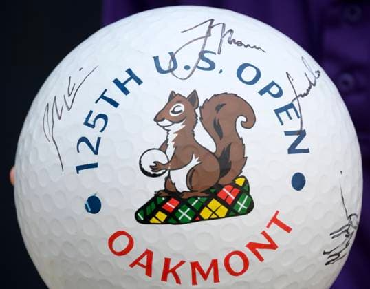 Fans collect autographs on an oversized golf ball at the USGA 125 U.S. Open Championship in Oakmont Pennsylvania near Pittsburgh on Monday, June 9, 2025.  PIT2025060902 ArchiexCarpenter