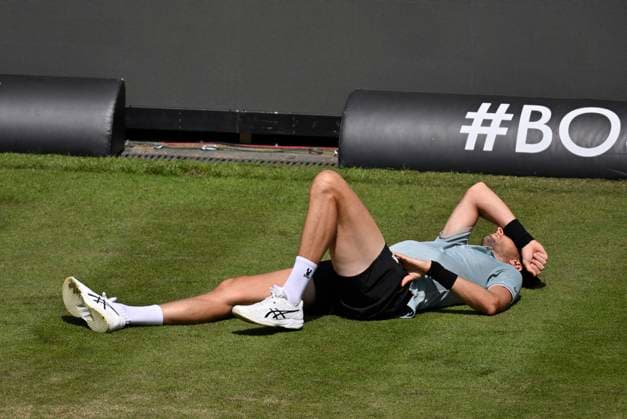 Arthur Rinderknech FRA lies injured on the ground Injury Tennis Men BOSS Open ATP 250 Stuttgart 2025 Weissenhof BOSS Open ATP 250 Stuttgart 2025