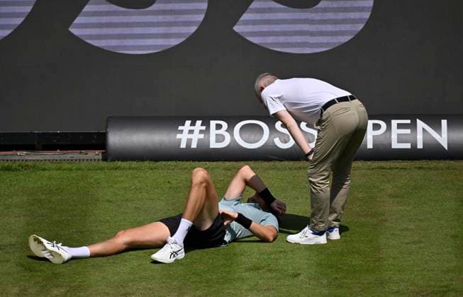 Arthur Rinderknech FRA lies injured on the ground Injury Chair umpire Timo Janzen takes care of himself Tennis Men BOSS Open ATP 250 Stuttgart 2025 Weissenhof BOSS Open ATP 250 Stuttgart 2025