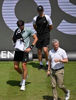 Arthur Rinderknech FRA lies injured on the ground Injury Chair umpire Timo Janzen takes care of himself Tennis Men BOSS Open ATP 250 Stuttgart 2025 Weissenhof BOSS Open ATP 250 Stuttgart 2025