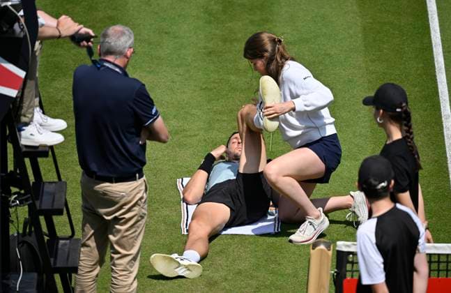 Arthur Rinderknech FRA lies injured on the ground Injury Treatment Physio Physiotherapist Treatment break Tennis Men BOSS Open ATP 250 Stuttgart 2025 Weissenhof BOSS Open ATP 250 Stuttgart 2025