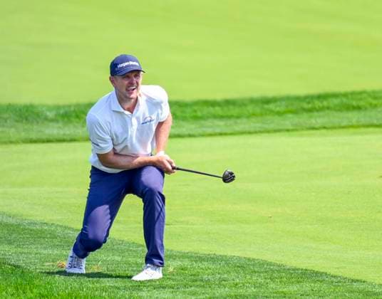 Justin Rose of England reacts to his approach shot on the 18th fairway during a practice round for the 125th U.S. Open Golf Championship at Oakmont Country Club in Oakmont, Pennsylvania on Wednesday, June 11, 2025. The tournament will take place from June 12 to June 15, 2025.  PIT2025061211219 ARCHIExCARPENTER