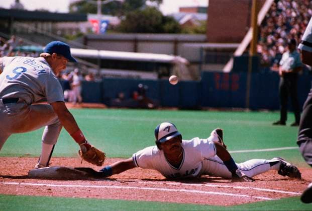 August 3, 1985, Toronto, On: Blue Jays outfielder Jesse Barfield dives safely back to first base as the ball gets away from Texas Rangers first baseman Peter O Brien in a game at Exhibition Stadium in Toronto on Saturday, Aug. 3, 1985. Jesse Barfield, Peter O Brien  - ZUMAc35_ 19850803_zaf_c35_001 Copyright: xMikexBlakex
