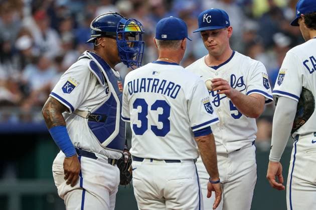 June 11, 2025: Kansas City Royals manager Matt Quatraro (33) takes the ball from starting pitcher Kris Bubic (50) during the fifth inning as catcher Salvador Perez (13) looks on against the New York Yankees at Kauffman Stadium in Kansas City, MO. CSM Kansas City United States of America - ZUMAc04_ 20250611_zma_c04_039 Copyright: xDavidxSmithx