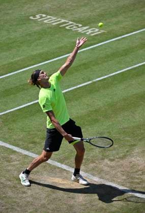 Alexander Zverev GER Action Serve Logo Stuttgart on grass Tennis Men BOSS Open ATP 250 Stuttgart 2025 Weissenhof BOSS Open ATP 250 Stuttgart 2025
