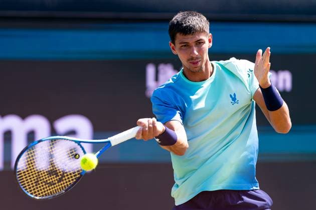 2025-06-12 2025 Libema Open Grass Court Championships ROSMALEN, NETHERLANDS - JUNE 12: Alexei Popyrin of Australia in action during Day Four of 2025 Libema Open Grass Court Championships at Autotron on June 12, 2025 in Rosmalen, Netherlands. Rosmalen Autotron Netherlands Content not available for redistribution in The Netherlands directly or indirectly through any third parties. Copyright: xJorisxVerwijstx