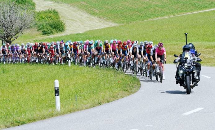 13 06 2025 Gippingen Switzerland Cycling GP Gippingen Grand Prix of the Canton of Aargau Picture The Peleton at full speed Right Television Motorcycle