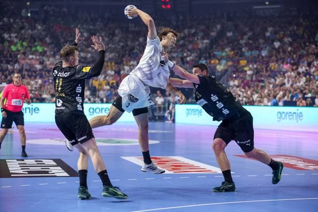 14 06 2025, Handball, Semi-final TruckScout24 EHF FINAL4, LANXESS arena Cologne, Füchse Berlin HBC Nantes Thibaud Briet HBC Nantes FRA 03 against Lasse Bredekjaer Andersson Fuechse Berlin 11 and Mijajlo Marsenic Fuechse Berlin 93 North Rhine-Westphalia Germany