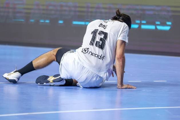 14 06 2025, Handball, Semi-final TruckScout24 EHF FINAL4, LANXESS arena Cologne, Füchse Berlin HBC Nantes Julien Bos HBC Nantes FRA 13 lies disappointed on the floor Disappointment North Rhine-Westphalia Germany
