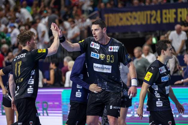 14 06 2025, Handball, Semi-final TruckScout24 EHF FINAL4, LANXESS arena Cologne, Füchse Berlin HBC Nantes Mijajlo Marsenic Fuechse Berlin 93 cheering next to Nils Lichtlein Fuechse Berlin 17 North Rhine-Westphalia Germany