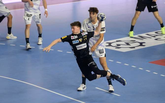 v l Nils LICHTLEIN B , Thibaud BRIET NAN duel, action, throw, Handball Champions League Final Four 2025, semi-final, Fuechse Berlin B HBC Nantes NAN , on 14 06 2025 in Cologne Germany Â
