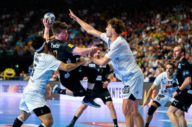 Cologne, Germany Handball EHF CL Final 4 Semifinal Fuechse Berlin HBC Nantes from left in duel Shuichi Yoshida Nantes , Nils Lichtlein Berlin , Thibaud Briet Nantes Cologne Lanxess Arena Nordrhein Westfalen Germany