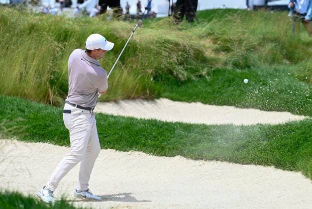 Rory McIlroy of Northern Ireland hits out of a bunker on the 14th hole during the third round of the 125th U.S. Open Golf Championship at Oakmont Country Club in Oakmont, Pennsylvania on Saturiday, June 14, 2025.  PIT20250614602 ARCHIExCARPENTER