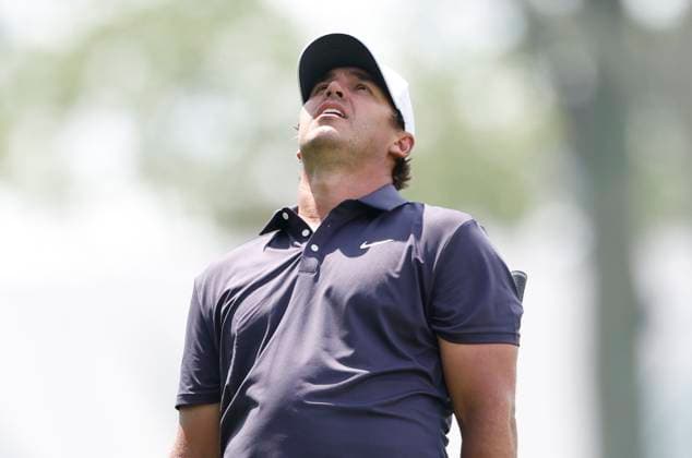 Brooks Koepka reacts after hitting his approach shot on the 1st hole during the third round of the 125th U.S. Open Golf Championship at Oakmont Country Club in Oakmont, Pennsylvania on Saturiday, June 14, 2025.  PIT20250614611 JOHNxANGELILLO