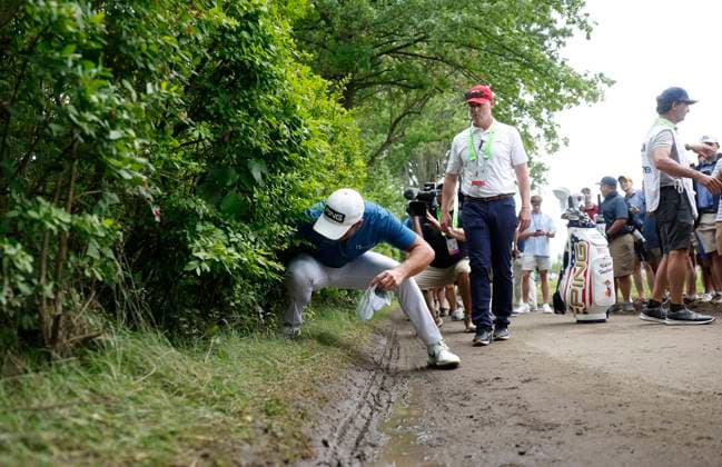 Viktor Hovland of Norway looks for his ball after hitting into the bushes on the 1st hole during the third round of the 125th U.S. Open Golf Championship at Oakmont Country Club in Oakmont, Pennsylvania on Saturiday, June 14, 2025.  PIT20250614614 JOHNxANGELILLO