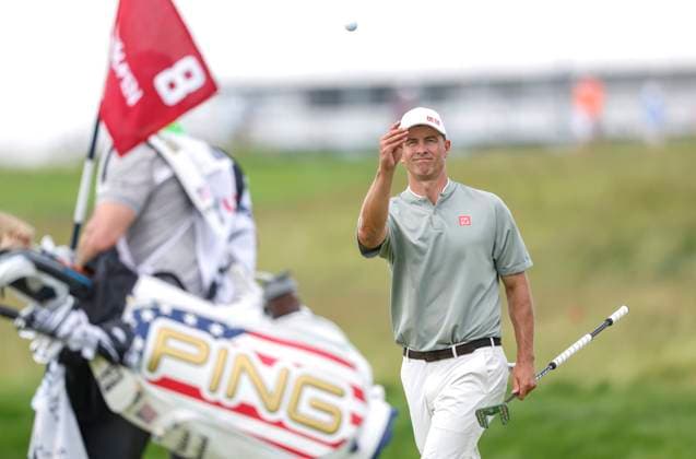Adam Scott of Australia tosses his ball to his caddie after putting for par on the 8th hole during the third round of the 125th U.S. Open Golf Championship at Oakmont Country Club in Oakmont, Pennsylvania on Saturiday, June 14, 2025.  PIT20250614632 JOHNxANGELILLO