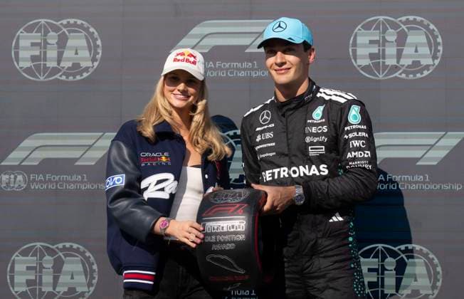June 14, 2025, Montreal, Qc, CANADA: Pole position winner Mercedes driver George Russell, of the United Kingdom, poses with for photos with Canadian swimmer Summer McIntosh after the qualifying session at the Canadian Grand Prix Saturday, June 14, 2025 in Montreal. Canada News - June 14, 2025  - ZUMAc35_ 20250614_zaf_c35_117 Copyright: xChristinnexMuschix
