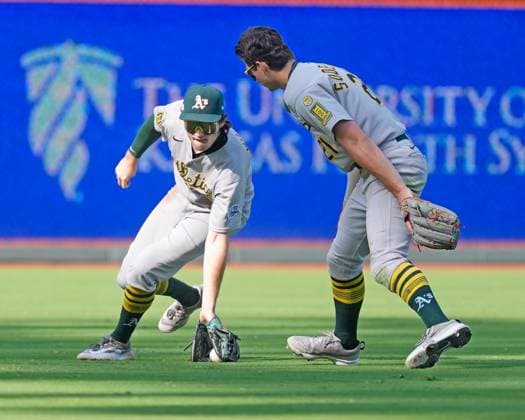 June 14, 2025: Athletics outfielder Tyler Soderstrom (21) and Athletics outfielder Denzel Clarke (1) track down a base hit in center field against the Athletics at Kauffman Stadium Kansas City, Missouri. CSM. Kansas City United States - ZUMAc04_ 20250614_zma_c04_002 Copyright: xJonxRobichaudx