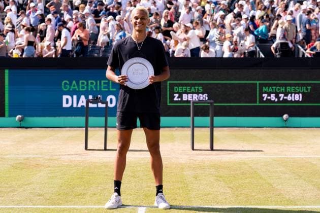 2025-06-15 2025 Libema Open Grass Court Championships ROSMALEN, NETHERLANDS - JUNE 15: Gabriel Diallo of Canada with his trophy during Day Seven of 2025 Libema Open Grass Court Championships at Autotron on June 15, 2025 in Rosmalen, Netherlands. Rosmalen Autotron Netherlands Content not available for redistribution in The Netherlands directly or indirectly through any third parties. Copyright: xJorisxVerwijstx