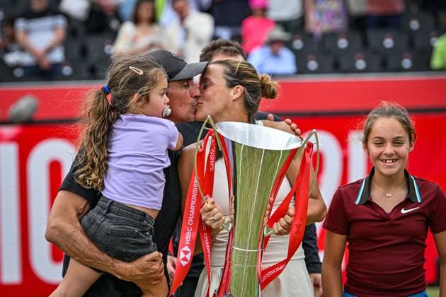 15th June 2025; HSBC Championships, Queens Club, West Kensington, London, England: HSBC Womens Championships Queens Club, Day 7; Tatjana Maria (GER) celebrates with her family with a kiss after winning 15th June 2025; HSBC Championships, Queens Club, West Kensington, London, England: HSBC Womens Championships Queens Club, Day 7; Tatjana Maria (GER) celebrates by lifting the new women s trophy after winning the womens singles final against Amanda Anisimova (USA)  ActionPlus12801499 GodfreyxPitt