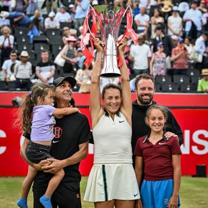 15th June 2025; HSBC Championships, Queens Club, West Kensington, London, England: HSBC Womens Championships Queens Club, Day 7; Tatjana Maria (GER) celebrates with her coach and family by lifting the new women s trophy after winning the final against Amanda Anisimova (USA)  ActionPlus12801501 GodfreyxPitt