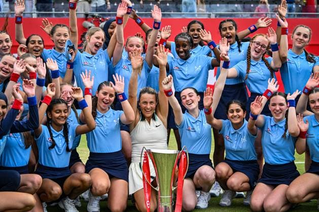 15th June 2025; HSBC Championships, Queens Club, West Kensington, London, England: HSBC Womens Championships Queens Club, Day 7; Tatjana Maria (GER) celebrates with the ball girls after winning the womens singles final against Amanda Anisimova (USA)  ActionPlus12801503 GodfreyxPitt