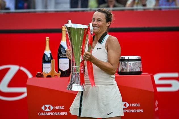 15th June 2025; HSBC Championships, Queens Club, West Kensington, London, England: HSBC Womens Championships Queens Club, Day 7; Tatjana Maria (GER) celebrates by lifting the new women s trophy after winning the womens singles final against Amanda Anisimova (USA)  ActionPlus12801494 GodfreyxPitt