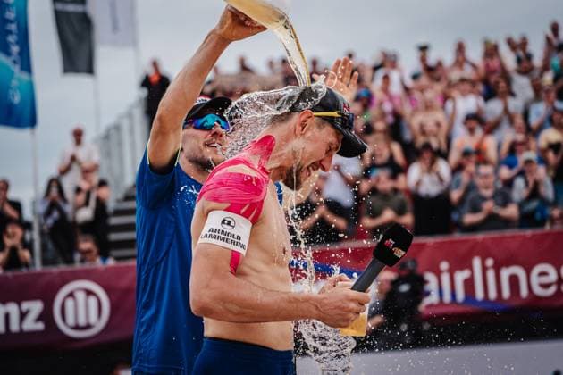 Beach volleyball men Allianz German Beach Tour 2025 Tourstop Bremen 15 06 2025 v l David Poniewaz pours beer over Bennet Poniewaz takes beer Bremen Waterfront Bremen Germany