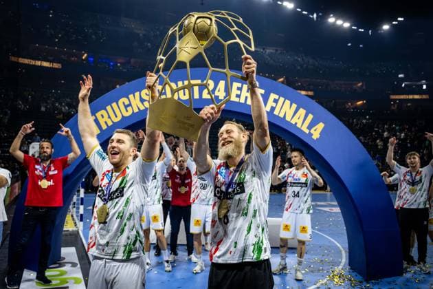 Handball Cologne 15 06 2025 EHF Final4 2025 Champions League Champions League Final Füchse Berlin SC Magdeburg SC Magdeburg is Champions League winner 2025 the team cheers in front of the fan curve Mertens Lukas Magdeburg, No 22 Musche Matthias Magdeburg, No 06 cheers