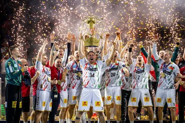 Handball Cologne 15 06 2025 EHF Final4 2025 Champions League Champions League Final Füchse Berlin SC Magdeburg SC Magdeburg is Champions League winner 2025 Damgaard Nielsen Michael Magdeburg, No 34 with trophy Award ceremony Cheers