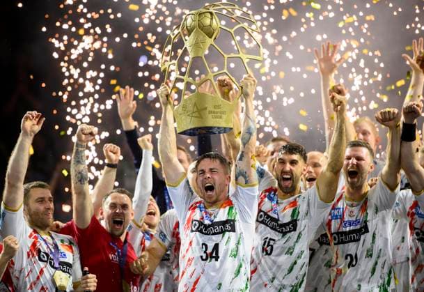 Award ceremony, cheering team MD with trophy held by Michael DAMGAARD MD, Handball Champions League Final Four 2025, Final, Fuechse Berlin B SC Magdeburg MD 26 32, on 15 06 2025 in Cologne Germany Â